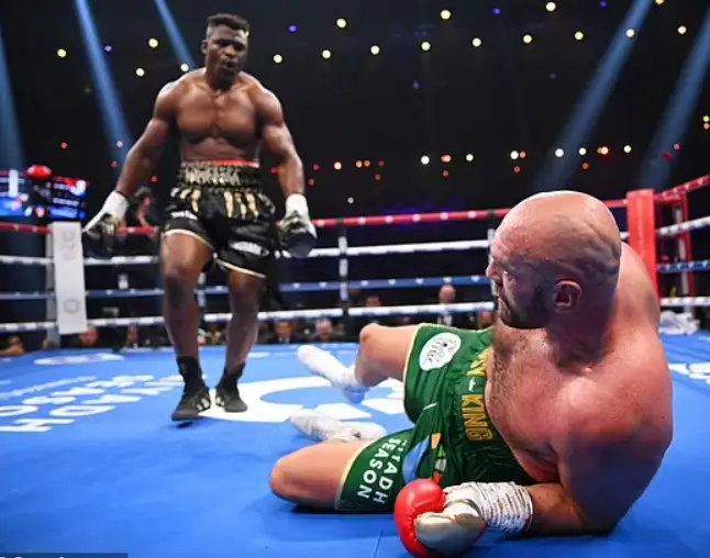 Fury knocked down but beat Ngannou on split decision