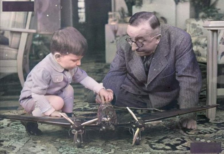 Professor Ernst Heinkel showing his youngest son a model of an He-111 bomber in 1941[Photo]