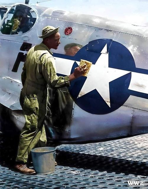 Photo of SSGT. William Accoo washing his Mustang with soap and water. 1944