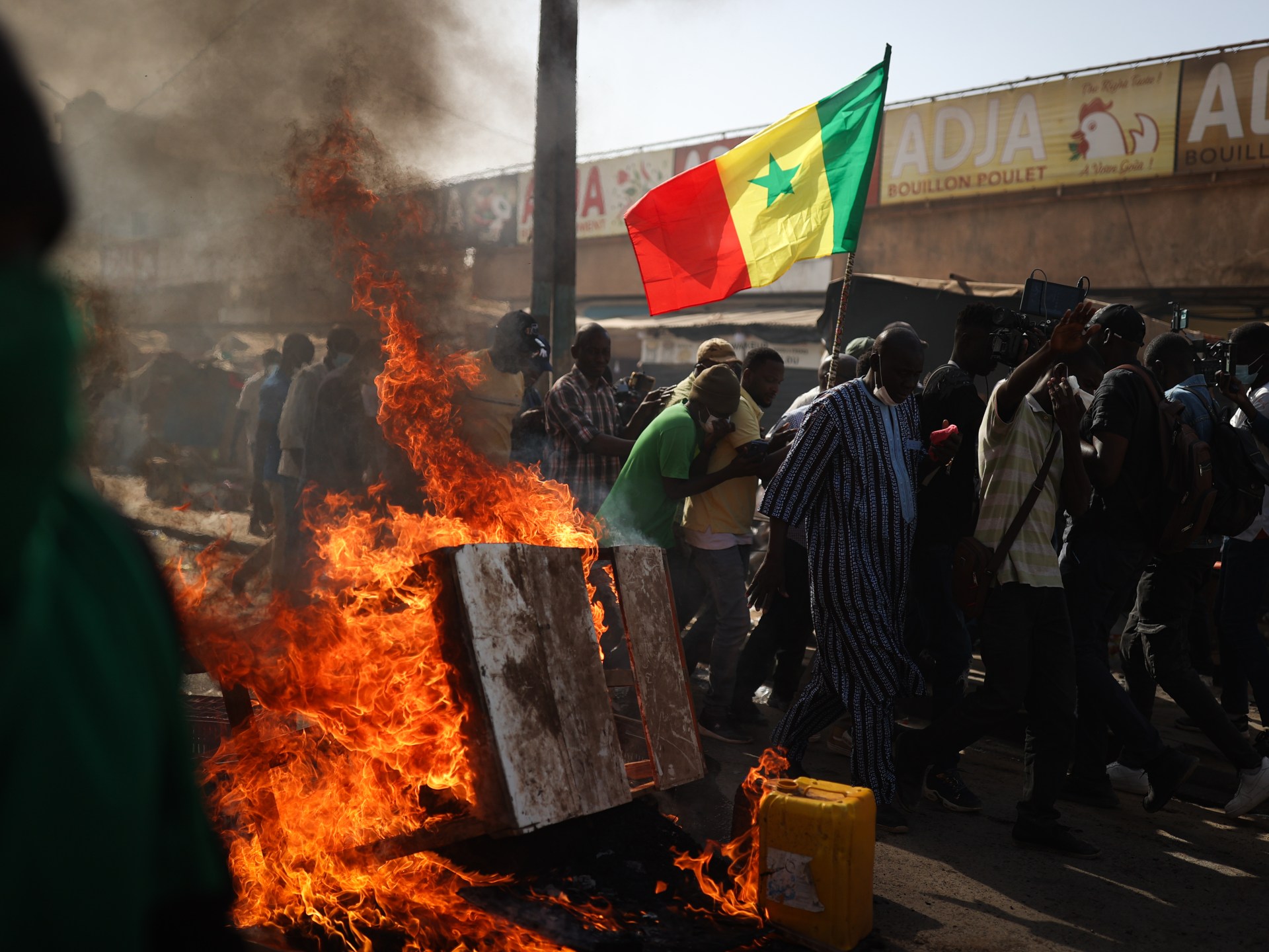 Police and protesters clash after Senegal election postponed