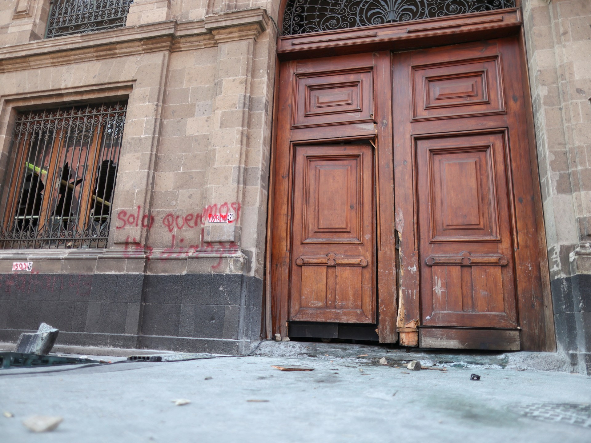 Ayotzinapa protesters knock down door of Mexico’s presidential palace