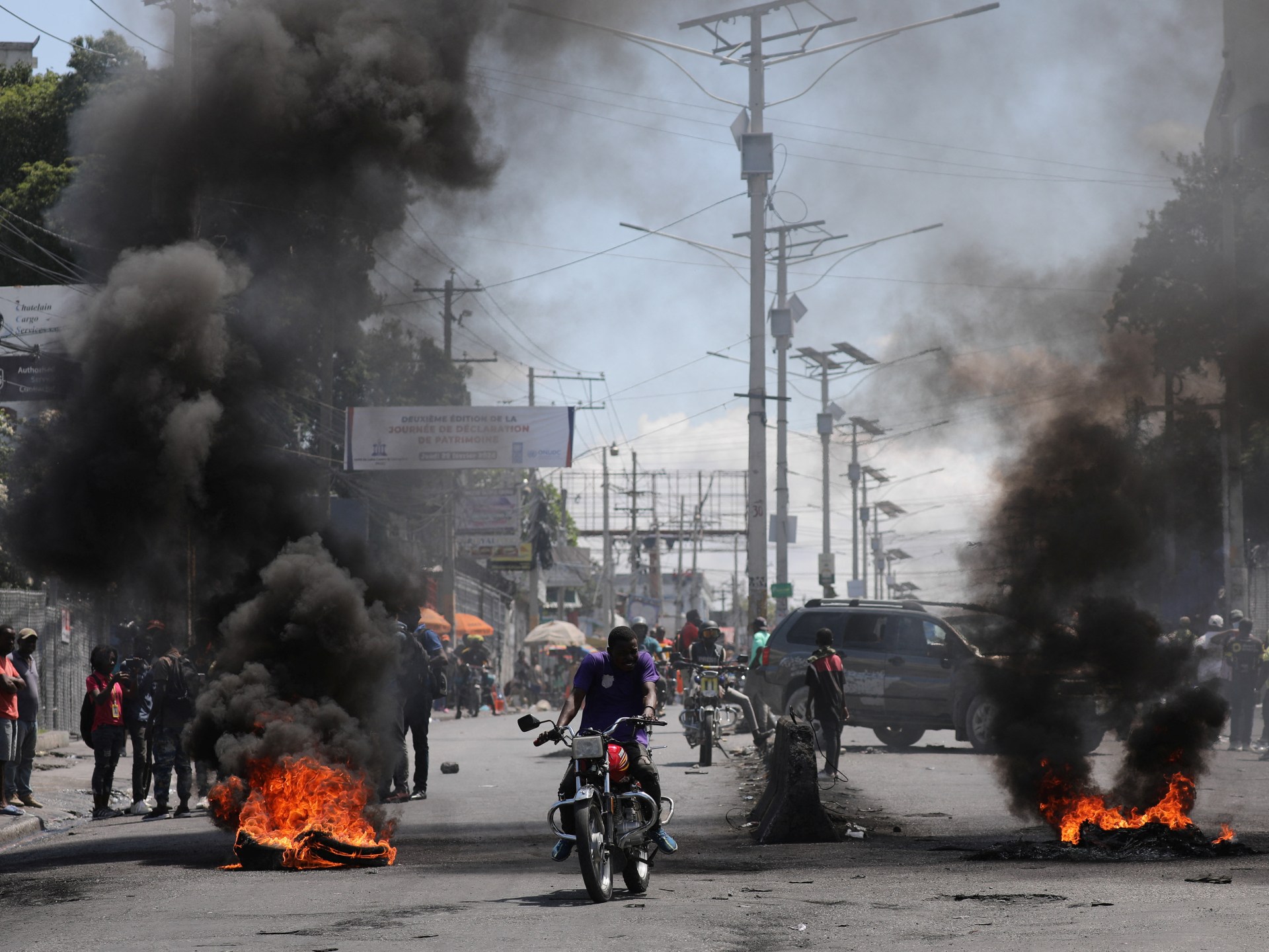 US military airlifts some embassy personnel from Haiti, bolsters security