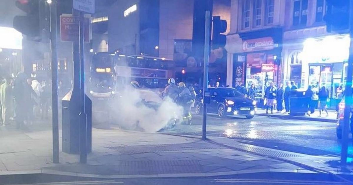 Fire fighters tackle blaze after taxi catches fire in city centre