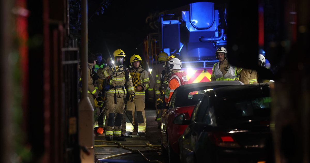 Smoke billows from windows as house goes up in flames