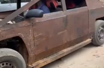 A mechanic takes a replica of the Cybertruck out for a test run, putting hands o