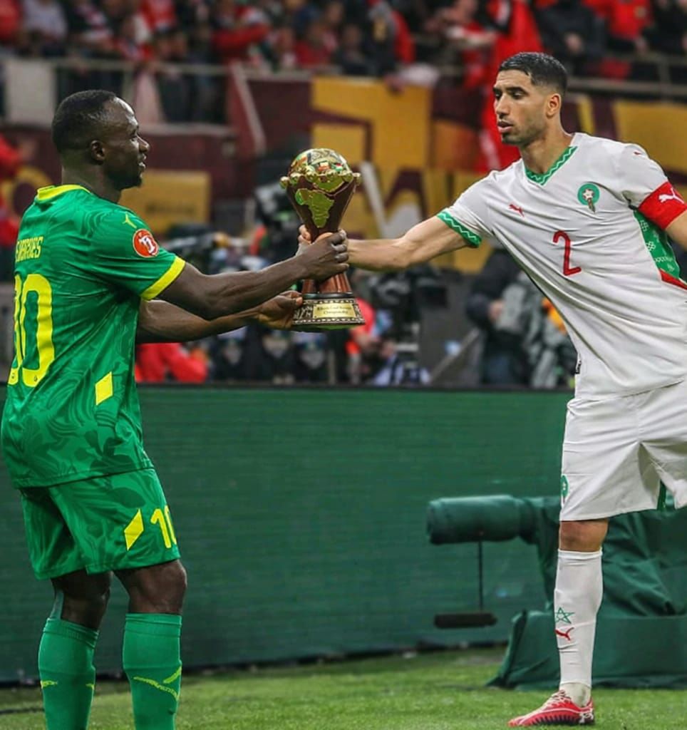 Hakimi was spotted begging Mané to let him touch the AFCON gold cup.