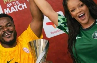 Viral photo of American star Rihanna raising Super Eagles goalkeeper Stanley Nwa