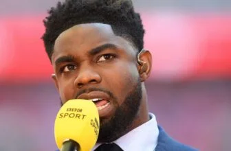 Micah Richards doing punditry for the BBC.