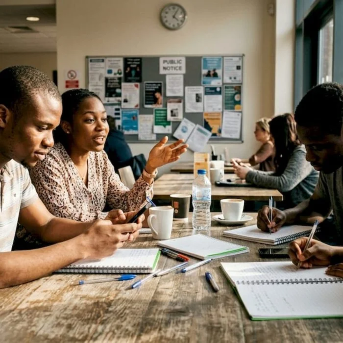 Nigerian students discussing issues in campus café