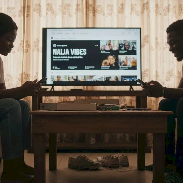 Young Nigerians on phones sharing content