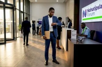 Nigerian candidate checks watch in reception