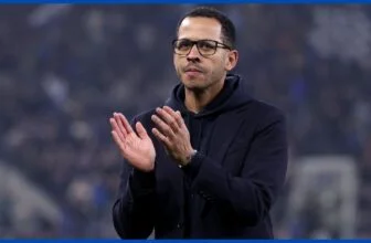Liam Rosenior applauds the fans.