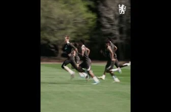 Chelsea players sprint in training.