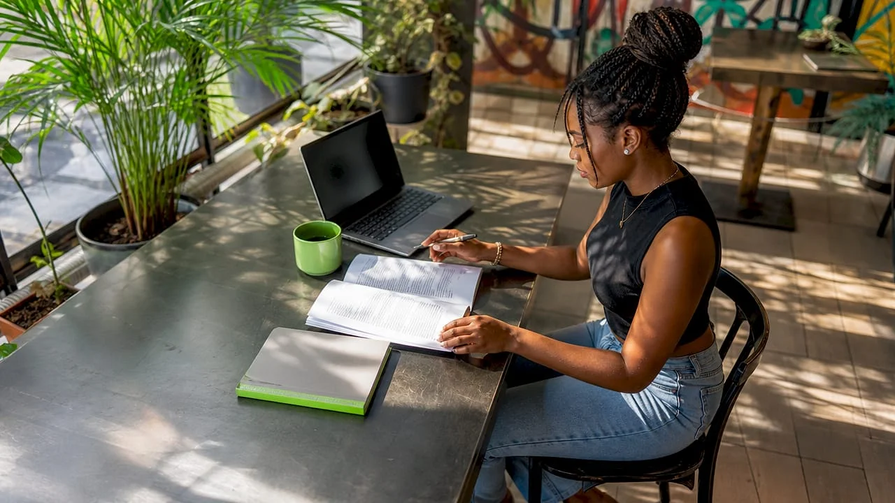 Skills in Demand 2026: What Nigerian Professionals Need 1 Nigerian woman studying AI literacy at home