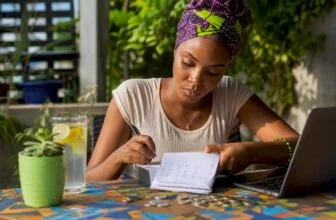 Young Nigerian woman reviewing budget at home