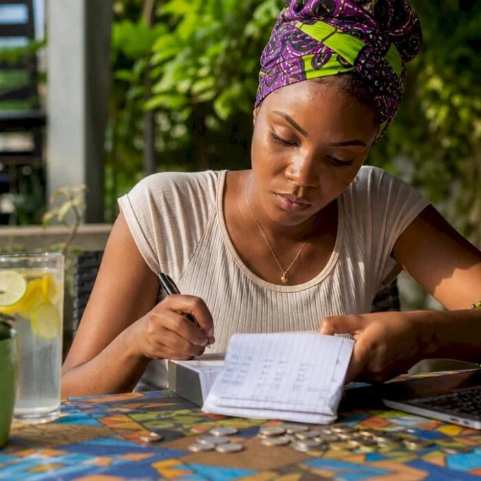 Young Nigerian woman reviewing budget at home