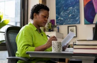 Woman reviewing misinformation article at desk