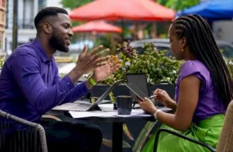Two writers collaborating on satirical news scripts