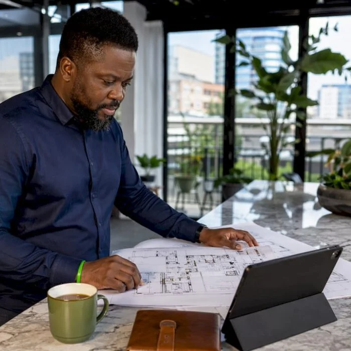 Nigerian entrepreneur reviewing business plans