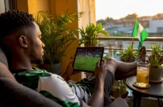 Nigerian fan watching Super Eagles football match