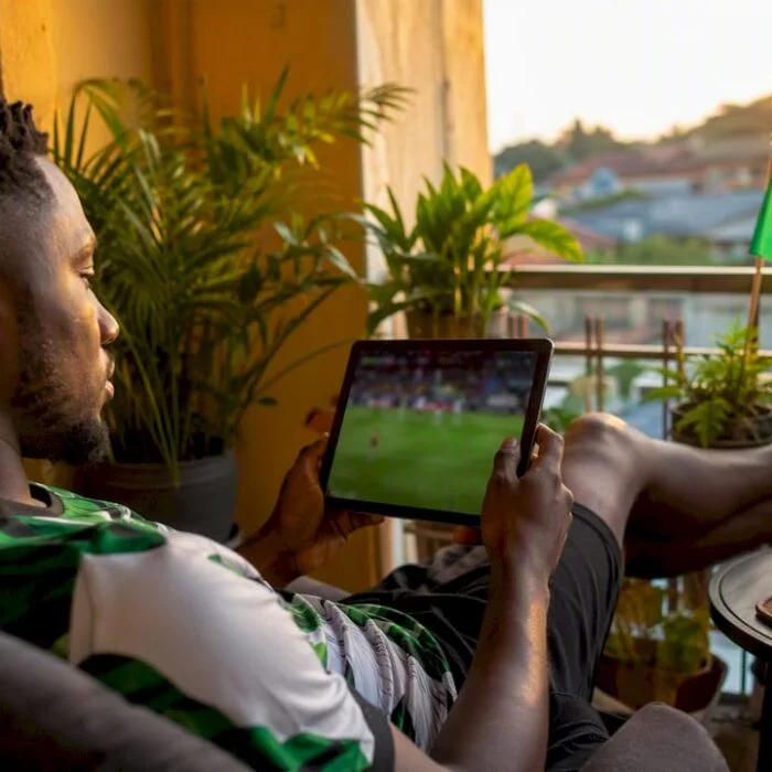 Nigerian fan watching Super Eagles football match