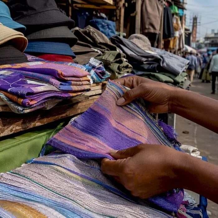 Close-up of Nigerian streetwear fabrics and accessories