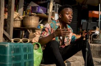 Nigerian skit maker filming a comedy scene outdoors