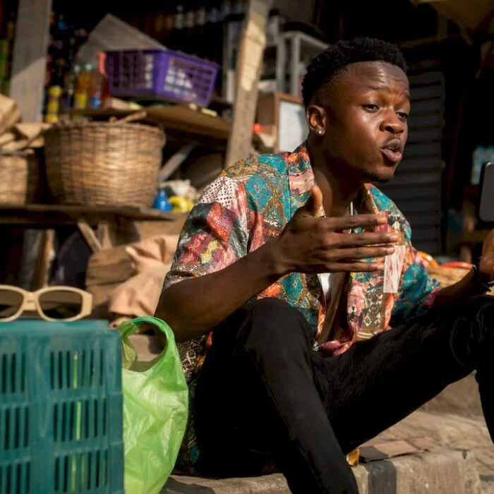 Nigerian skit maker filming a comedy scene outdoors