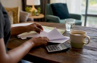 Hands managing household budget papers