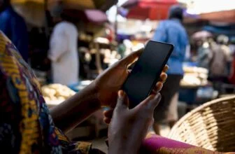Hands holding phone for online shopping