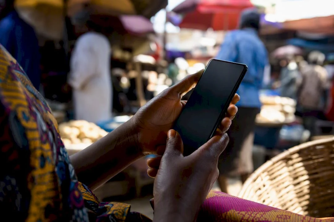 $10.49 Billion Market: Win Nigeria's Mobile First E Commerce 1 Hands holding phone for online shopping