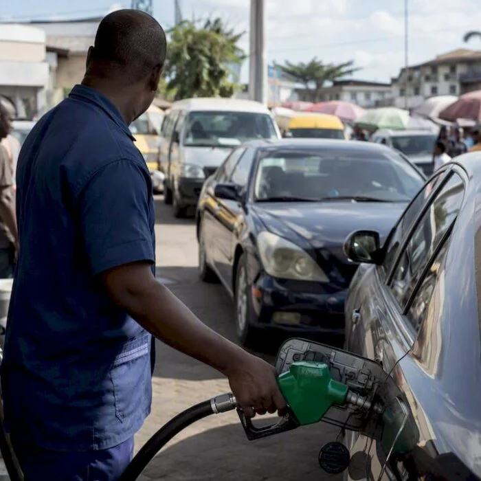 Fuel pump nozzle refueling vehicle