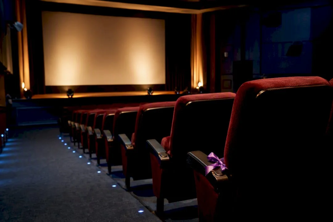 Empty Nigerian cinema auditorium under tribute lighting