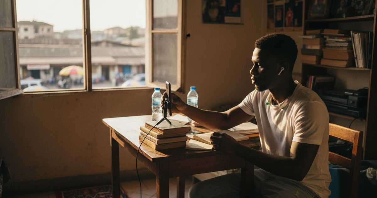 Nigerian influencer records video in urban home