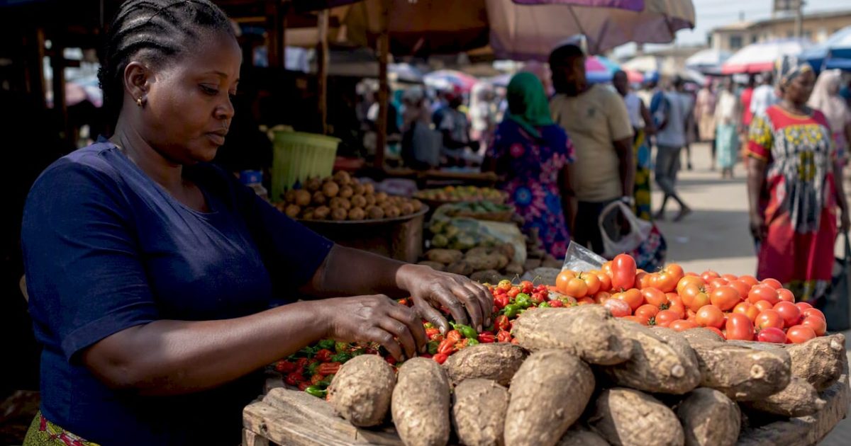 Poverty in Nigeria 2026: What the Data Really Shows 1 Food vendor arranging produce in Nigerian market