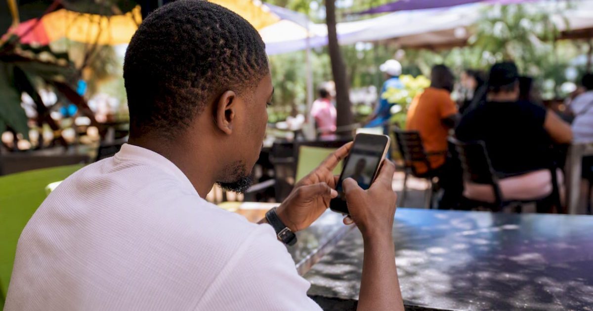 Reverse Image Search Guide: Find Any Photo's Source 1 Hands cropping photo on smartphone
