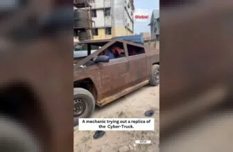 A mechanic takes a replica of the Cybertruck out for a test run, putting hands o